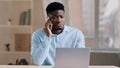 African american man businessman freelancer worker talk chatter on mobile cellphone with client make business call