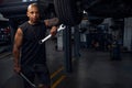 African American man from car repair shop holding two large wrenches Royalty Free Stock Photo