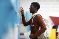 African-American Man Choosing Books Royalty Free Stock Photo