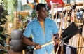 African american man choosing shovel at gardening tools store Royalty Free Stock Photo