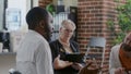 African american man complaining about alcohol addiction and recovery at aa group meeting Royalty Free Stock Photo