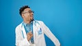 African american man doctor smiling confident dancing over isolated blue background Royalty Free Stock Photo