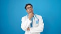 African american man doctor standing with doubt expression thinking over isolated blue background Royalty Free Stock Photo