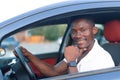 An African-American man driving a car. Human emotions Royalty Free Stock Photo