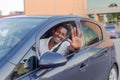 An African-American man driving a car. Human emotions Royalty Free Stock Photo