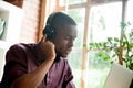 African american man enjoying music in headphones with eyes clos Royalty Free Stock Photo