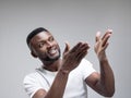 African american man excited about watching tv. Royalty Free Stock Photo