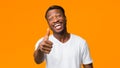 African American Man Gesturing Thumbs Up Standing In Studio. Panorama Royalty Free Stock Photo