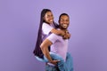 African American man giving piggyback ride for his lady Royalty Free Stock Photo