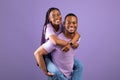 African American man giving piggyback ride for his woman Royalty Free Stock Photo