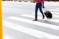 African American man on the go crossing the street