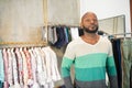 African American man going to buy male shirts in shop Royalty Free Stock Photo