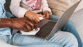 African American man with grandchild using sanitizer to clean laptop at home, closeup. Panorama Royalty Free Stock Photo