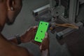 African american man with green screen phone with tracking points. Gym workout and sports app for exercising