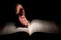 African American Man Hands Showing to the Bible, the Word of God