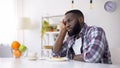 African-American man having no appetite, eating disorder, depression problem Royalty Free Stock Photo