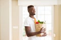 African american man holding paper bag full of groceries happy and smiling confident Royalty Free Stock Photo