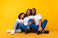 African American man hugging his smiling wife and daughter Royalty Free Stock Photo