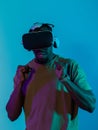 African American man immerses himself in a thrilling horror gaming experience using VR glasses, creating an isolated and