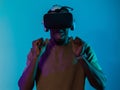 African American man immerses himself in a thrilling horror gaming experience using VR glasses, creating an isolated and