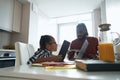 African American man listening intently his young daughter who reading book Royalty Free Stock Photo