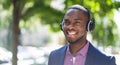 African American Man Listening Music On Wireless Headphones Royalty Free Stock Photo