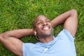 African American man lying in grass Royalty Free Stock Photo