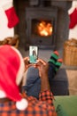 African american man making smartphone christmas video call with smiling senior father Royalty Free Stock Photo