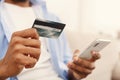 African-american man making transaction using mobile application Royalty Free Stock Photo