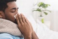 African-american man man has runny nose at home Royalty Free Stock Photo