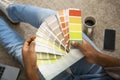 African american man millennial holds color swatch