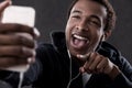 African American man pointing at phone screen Royalty Free Stock Photo