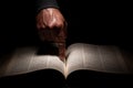 African American Man Pointing to the Bible, the Word of God Royalty Free Stock Photo