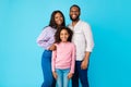 African American man posing with wife and smiling daughter Royalty Free Stock Photo