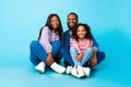 African American man posing with wife and smiling daughter Royalty Free Stock Photo