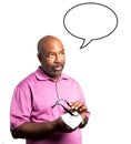 African American man in a a purple shirt cleaning the lenses of a pair of eyeglasses with a microfiber cloth Royalty Free Stock Photo