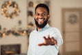 African american man reaching hand to camera