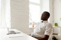 African-american man relaxing after work breathing air in home o Royalty Free Stock Photo