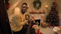 African American man records video on Christmas family dinner Royalty Free Stock Photo