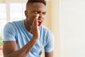 African american man shouting with rage, yelling excited with hand on mouth Royalty Free Stock Photo