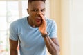 African american man shouting with rage, yelling excited with hand on mouth Royalty Free Stock Photo