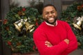 African American man smiling outside at Christmas. Royalty Free Stock Photo