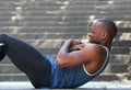 African american man sport training workout sit ups outside