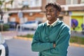 African american man standing with arms crossed gesture at street Royalty Free Stock Photo