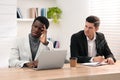 African American man suffering from racial discrimination at work Royalty Free Stock Photo