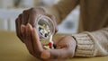 African American man takes daily doze of vitamins in morning