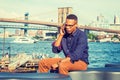 Young black man talking on cell phone outdoors in New York City Royalty Free Stock Photo