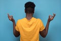 African american man turning back having relaxation while meditating