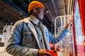 African-American man uses self-service kiosk to order snack Royalty Free Stock Photo