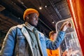 African-American man uses self-service kiosk to order snack Royalty Free Stock Photo